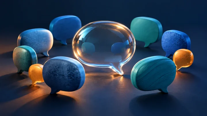 Blue and teal speech bubbles surrounding a transparent central bubble